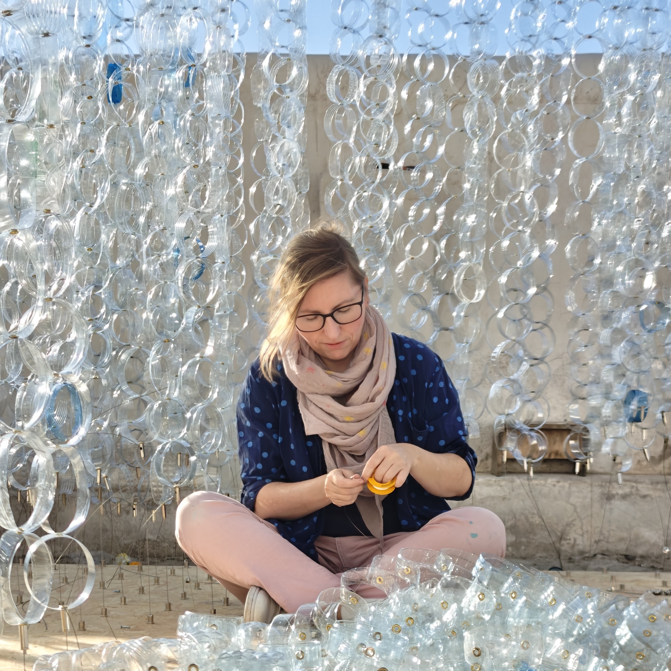 Artist Anja Bamberg creating Suspended Threads